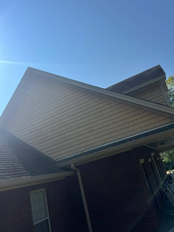 Roofing crew installing new shingles on a Montgomery, AL home