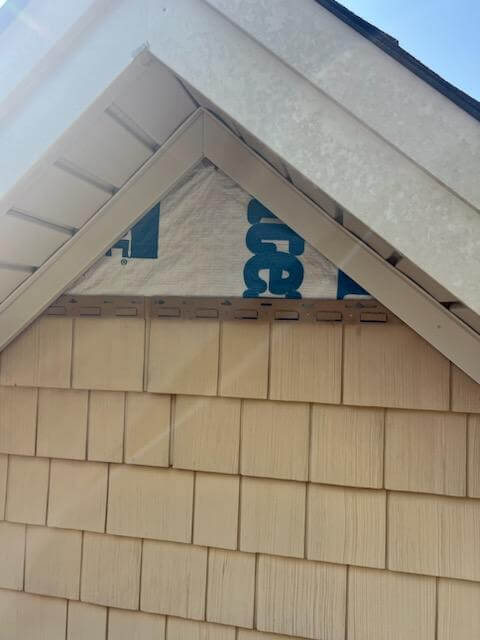 Close-up of new roof flashing and ridge vent installed by Alabama Signature Homes